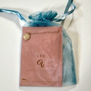 Anthropologie gold necklace, Leo zodiak